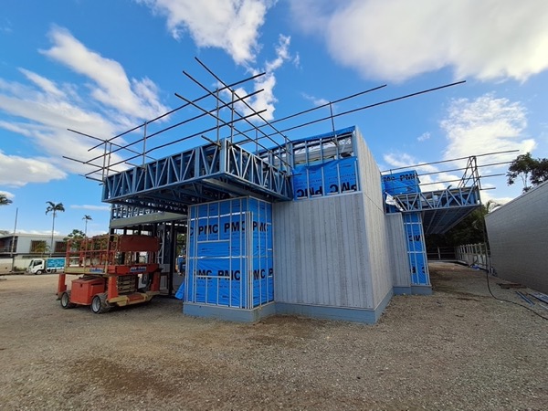 A steel-framed structure going up on a building site